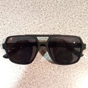 Sunglasses black aviator foster and grant UV protection.